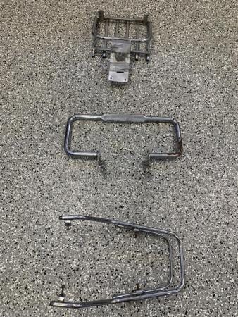 This is a still of a vespa p200e luggage carrier rack, front mudguard bumper bar & rear grab bar rail
