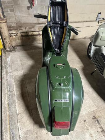 This is a pictorial representation of a 1977 vespa t.s (jungla verde)