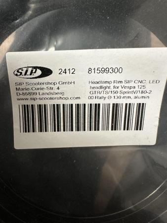 This is a snapshot of a vespa headlight rim