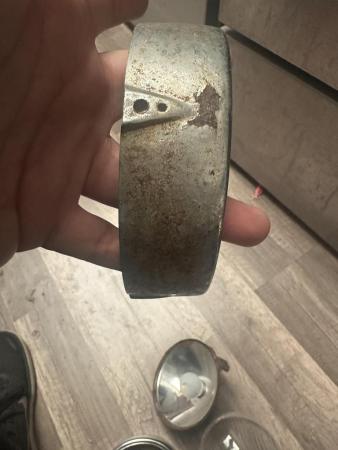 This is a pictorial representation of a vespa cev headlight rim